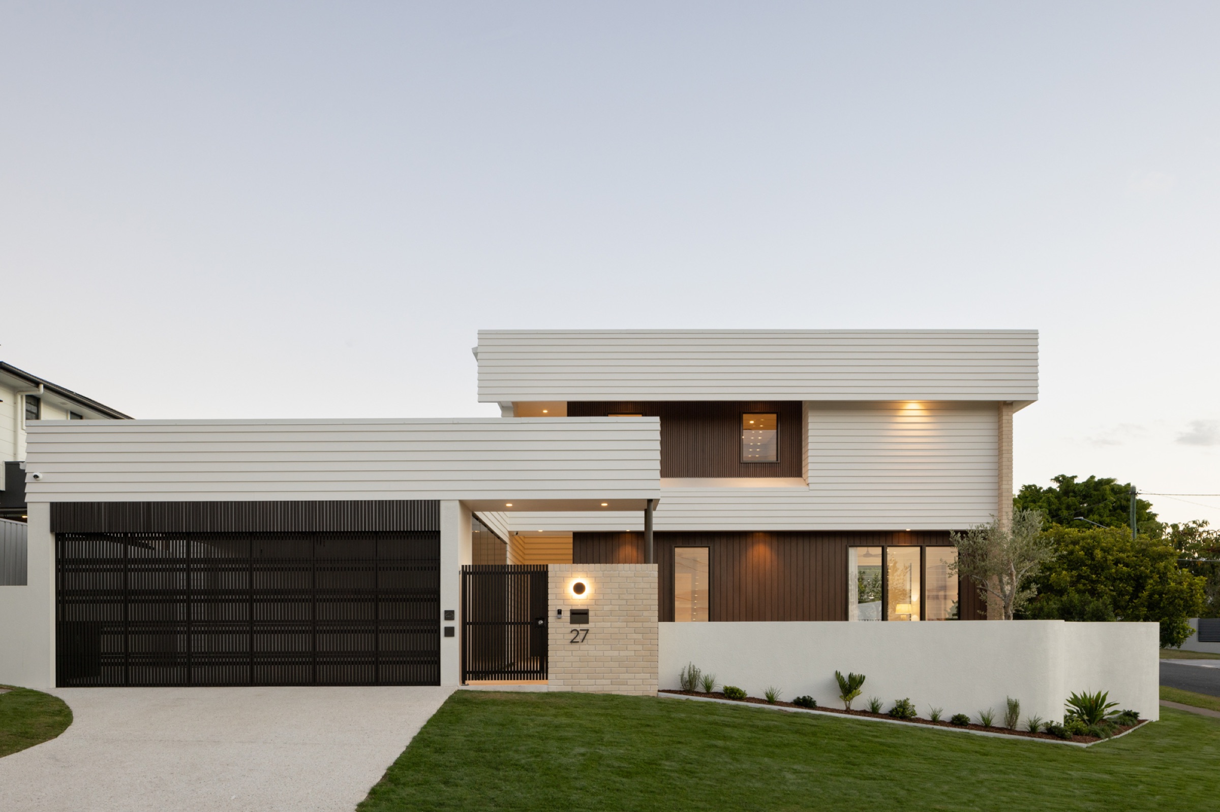 HNT Builders custom new home, 27 Eleanor Street, Carina, photographed at dusk